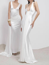 White halter mermaid gown styled for upscale formal events