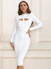 white high neck cut out midi dress with long sleeves on model
