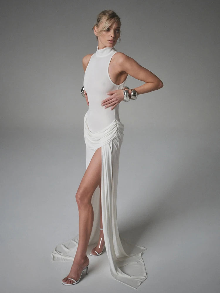 White high slit turtleneck gown styled for sleek evening events