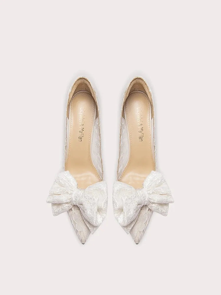 White lace bow wedding heels styled for bridal and celebration events