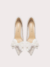 White lace bow wedding heels styled for bridal and celebration events
