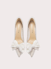 White lace bow wedding heels styled for bridal and celebration events
