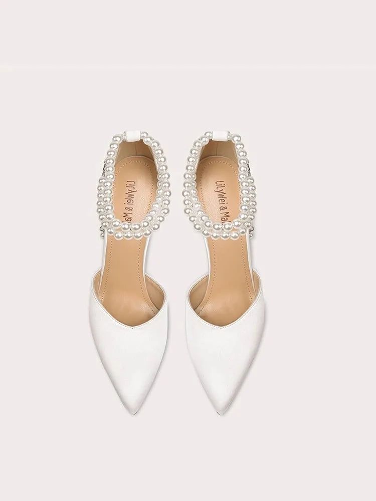 White pearl ankle strap heel sandals styled for weddings and parties