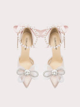 White silk stiletto heels with beaded bows and pearl string