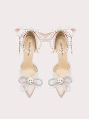 White silk stiletto heels with beaded bows and pearl string