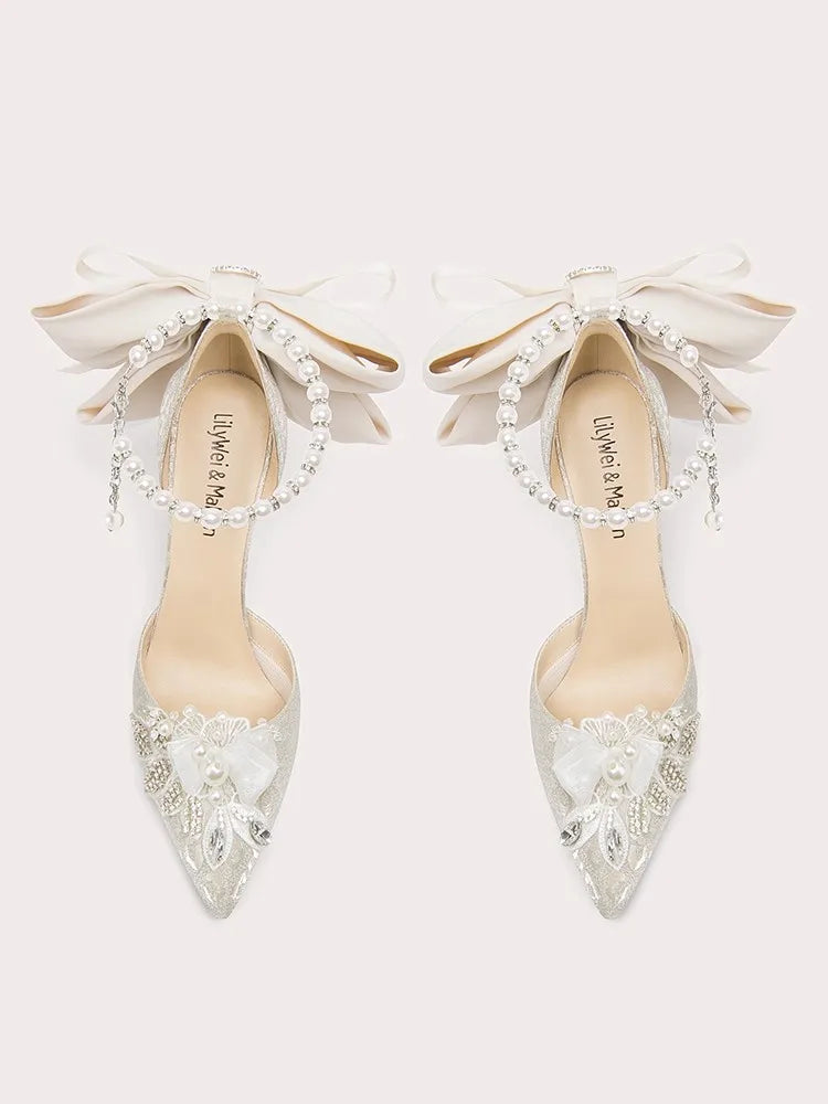 White pearl bow stiletto heels with lace and beaded details