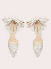 White pearl bow stiletto heels with lace and beaded details