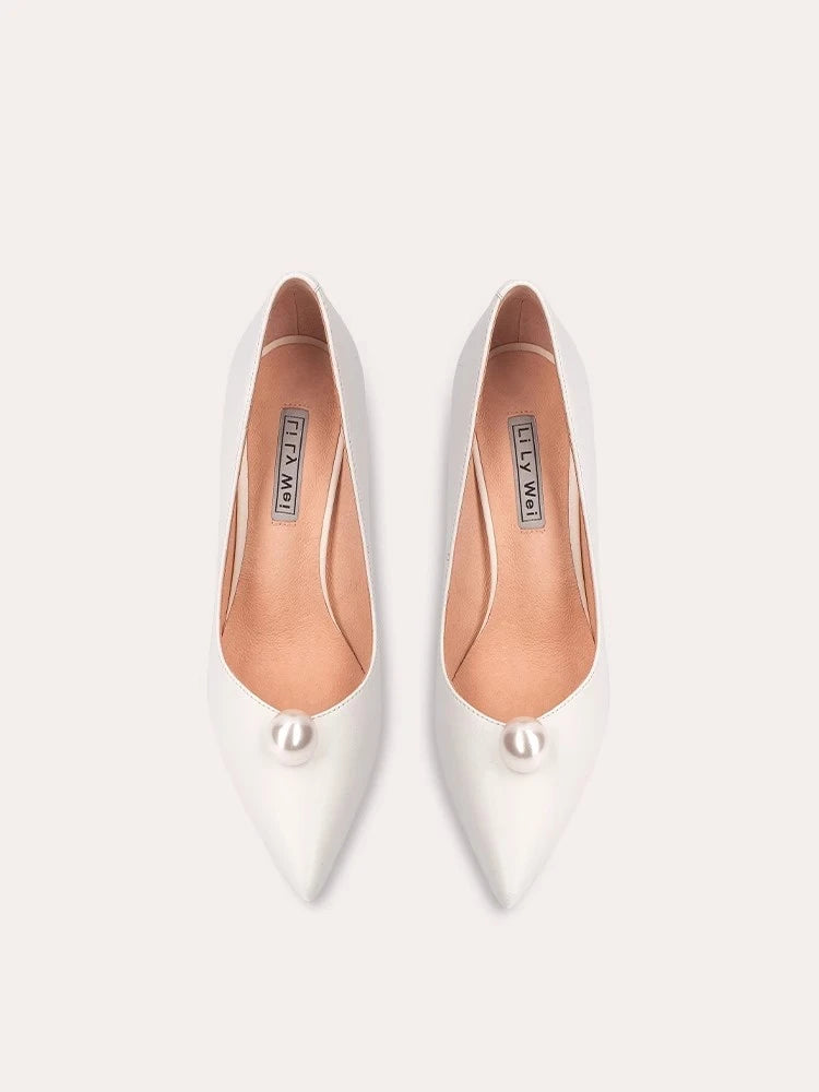 White pearl pointed pumps styled for weddings and modern parties