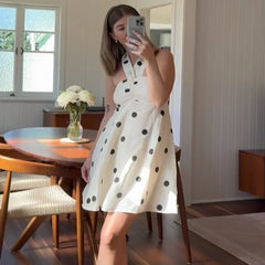 A-line polka dot mini dress styled with vintage flair