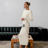 White puff sleeve open back maxi dress styled for modern events