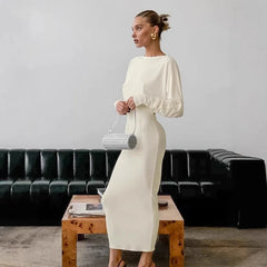 White puff sleeve open back maxi dress styled for modern events