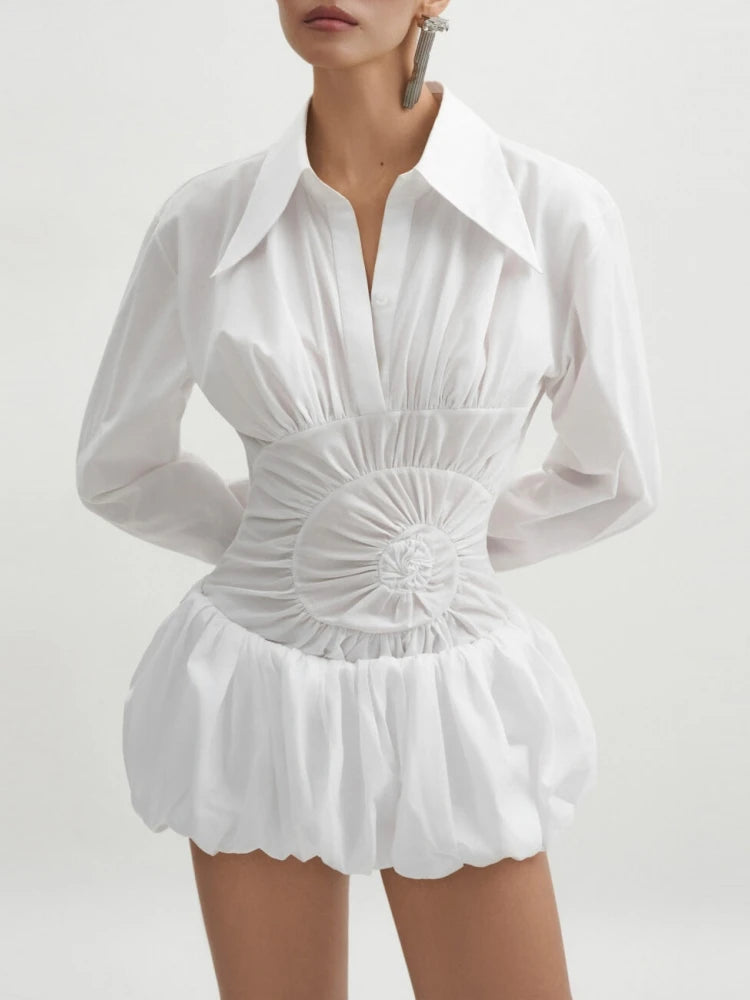 White shirt mini dress with cinched circular waist panel worn by a model on a white background