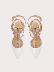 White studded strappy stiletto heels with patent toe and gold cage