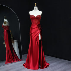 Sweetheart satin mermaid prom gown with crystal bodice on mannequin
