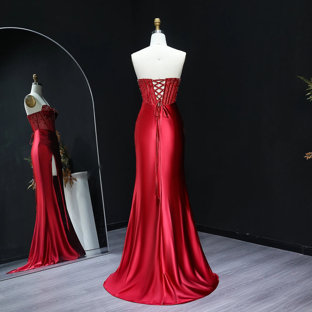 Full-length satin mermaid evening gown with high slit and draped finish