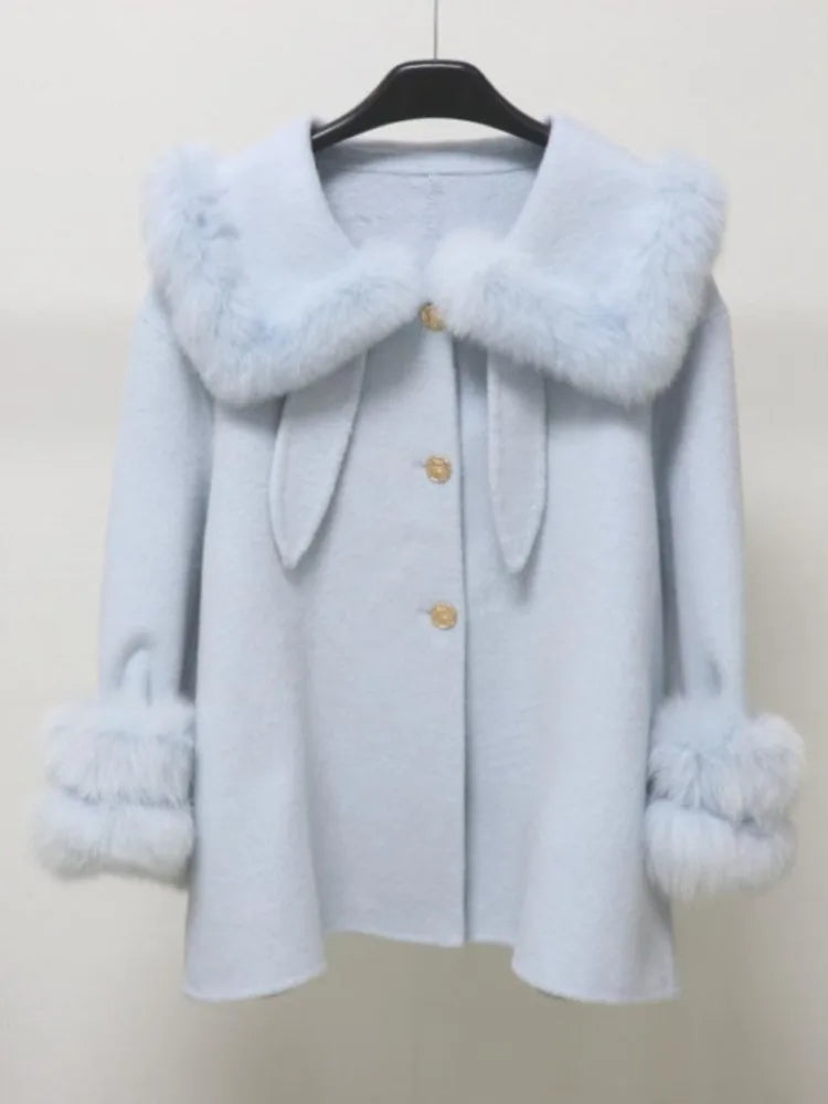 Winter coat with gold button accents and faux-fur details