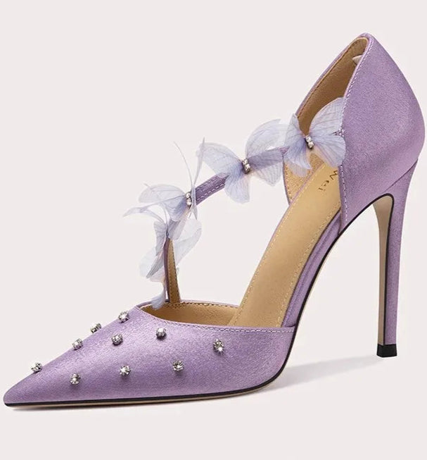 A full-length shot of women's dress shoes, styled with a formal outfit.