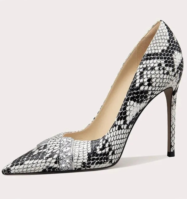 A full-length shot of women's dress shoes, styled with a formal outfit.