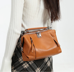 Cowhide leather handbag with cotton lining and multiple interior pockets