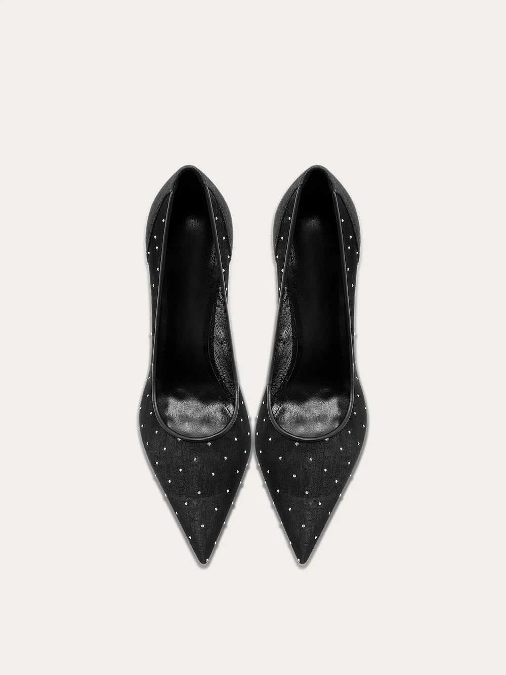 A full-length shot of women's party shoes, styled with a formal outfit.