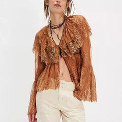 A full-length shot of a women's sheer shirt styled for a night out.