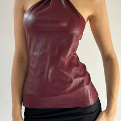 A slim club party camisole styled with a mini skirt.
