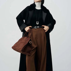 Women’s winter coat with belt and patchwork accents