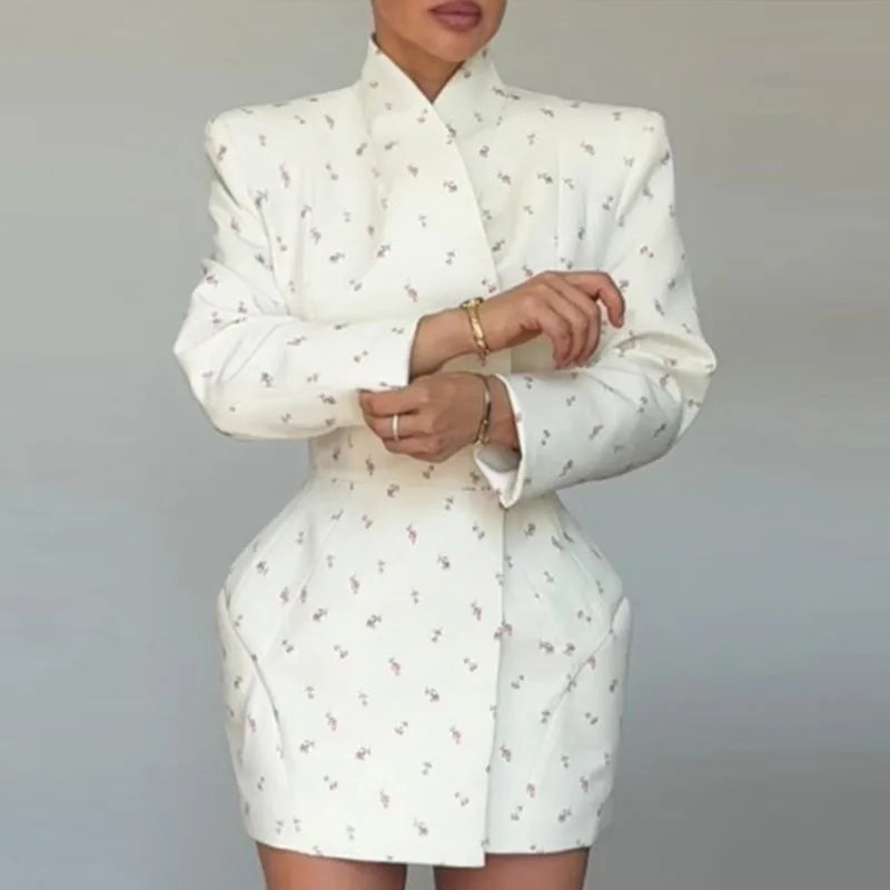 The structured silhouette of the short coat, showing its elegant fit.