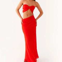 A woman modeling a Y2K strapless backless bodycon maxi dress.