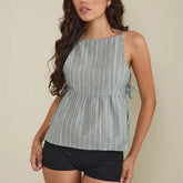 Y2K striped peplum tank top with tie sides worn by model