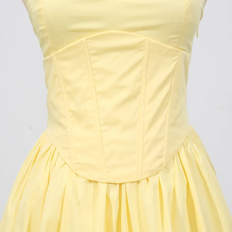 Yellow celebration dress with v-neck and intricate embroidered detail
