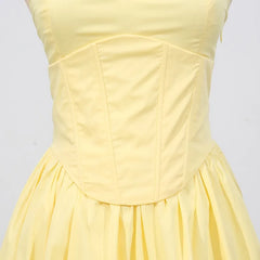 Yellow celebration dress with v-neck and intricate embroidered detail