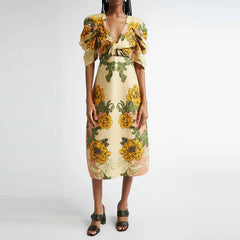 Yellow floral print midi dress styled for summer and travel days