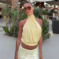 Halter tank top with gathered neckline and open back detail