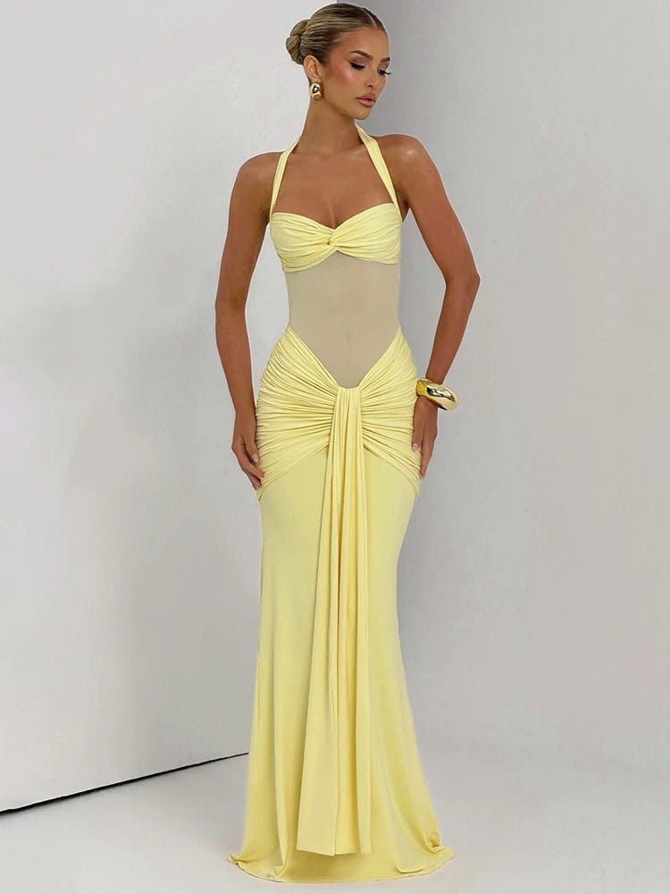 Yellow halter maxi dress with ruched bodice and floor length fit