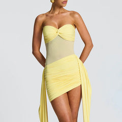 Close-up of ruched bodice and sheer midsection in yellow dress