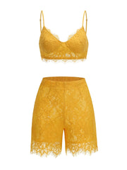 Yellow lace bralette and shorts set on a white background