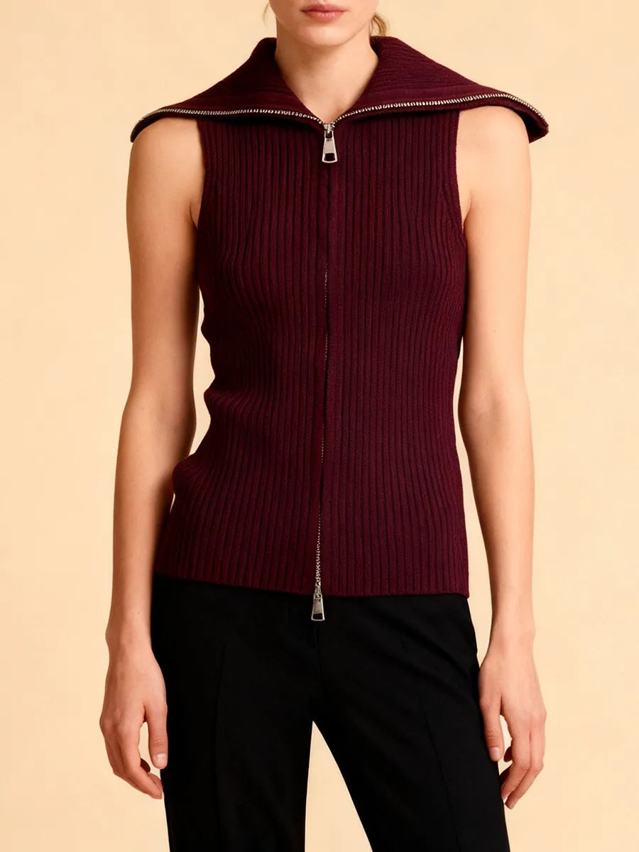 Front view highlighting the vertical zip closure and smooth ribbed texture of the knit