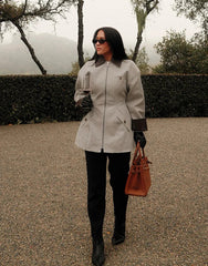 Zip-front lapel jacket with tailored panel seams and clean lines