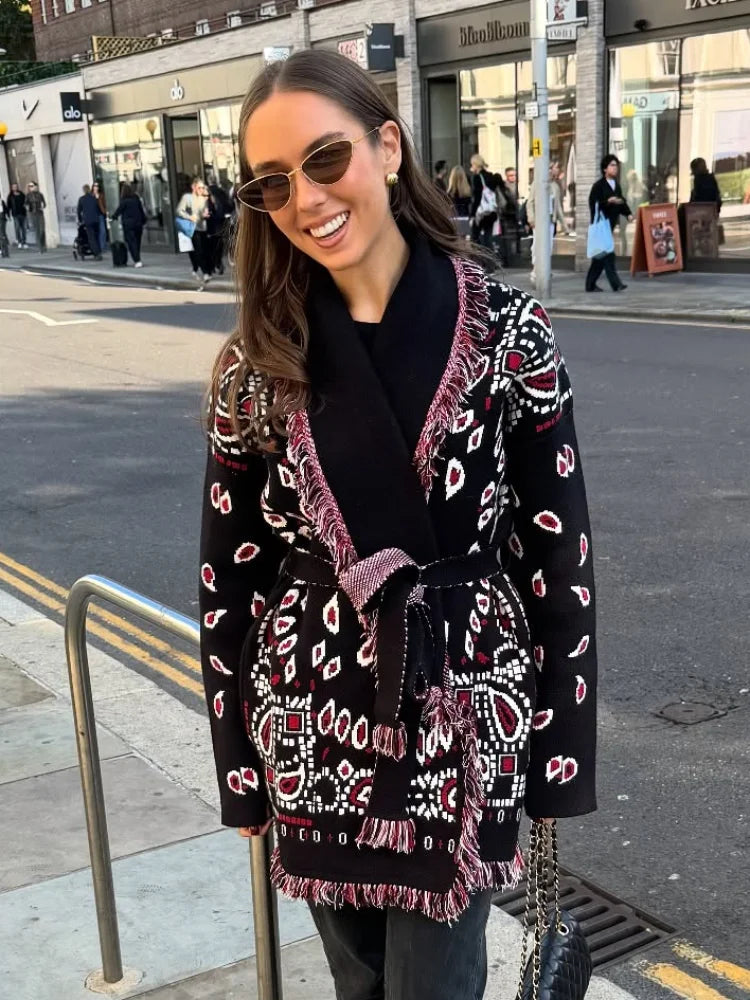 Woman wearing a patterned coat on a city street