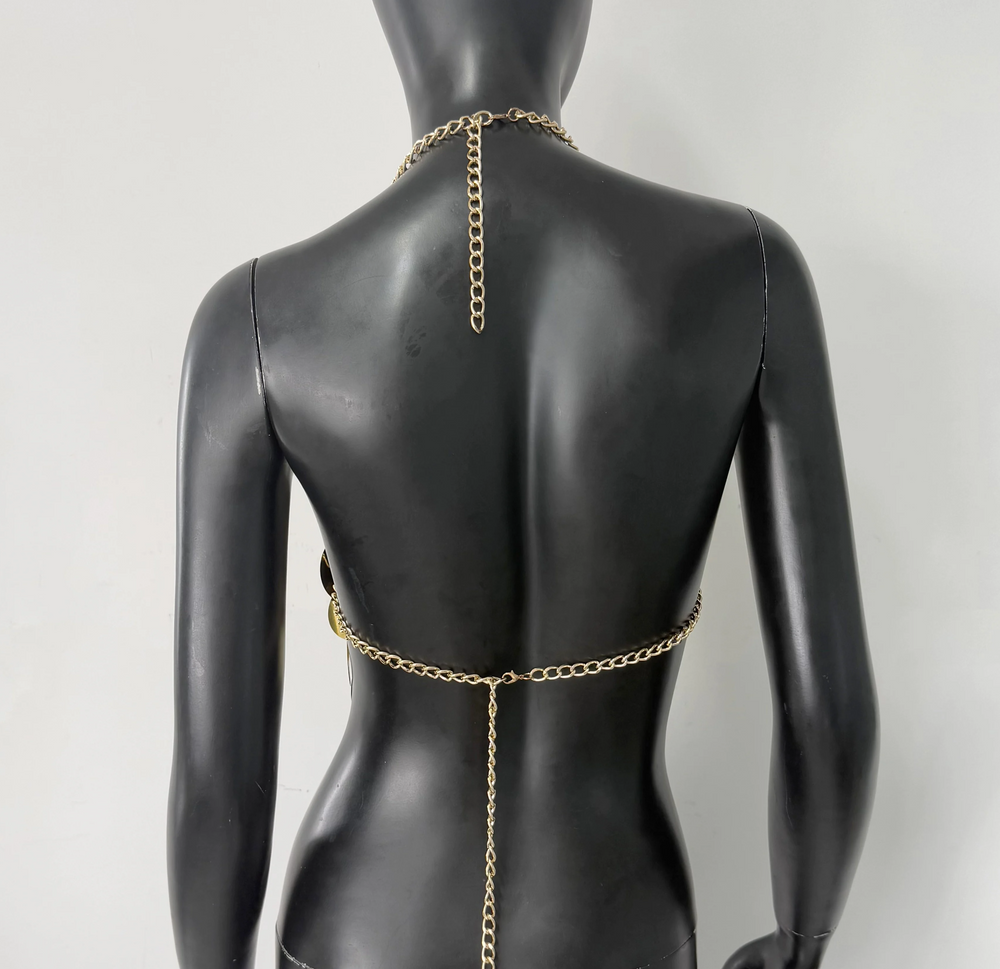 Gold sequin halter top on a mannequin, back view