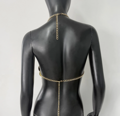 Gold sequin halter top on a mannequin, back view
