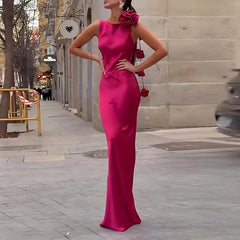 Floor-length pink satin dress styled outdoors
