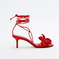 Open-toe lace-up stilettos with flower embellishments- side view
