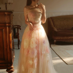 A woman wearing an elegant off-shoulder evening gown with 3D floral appliqués.