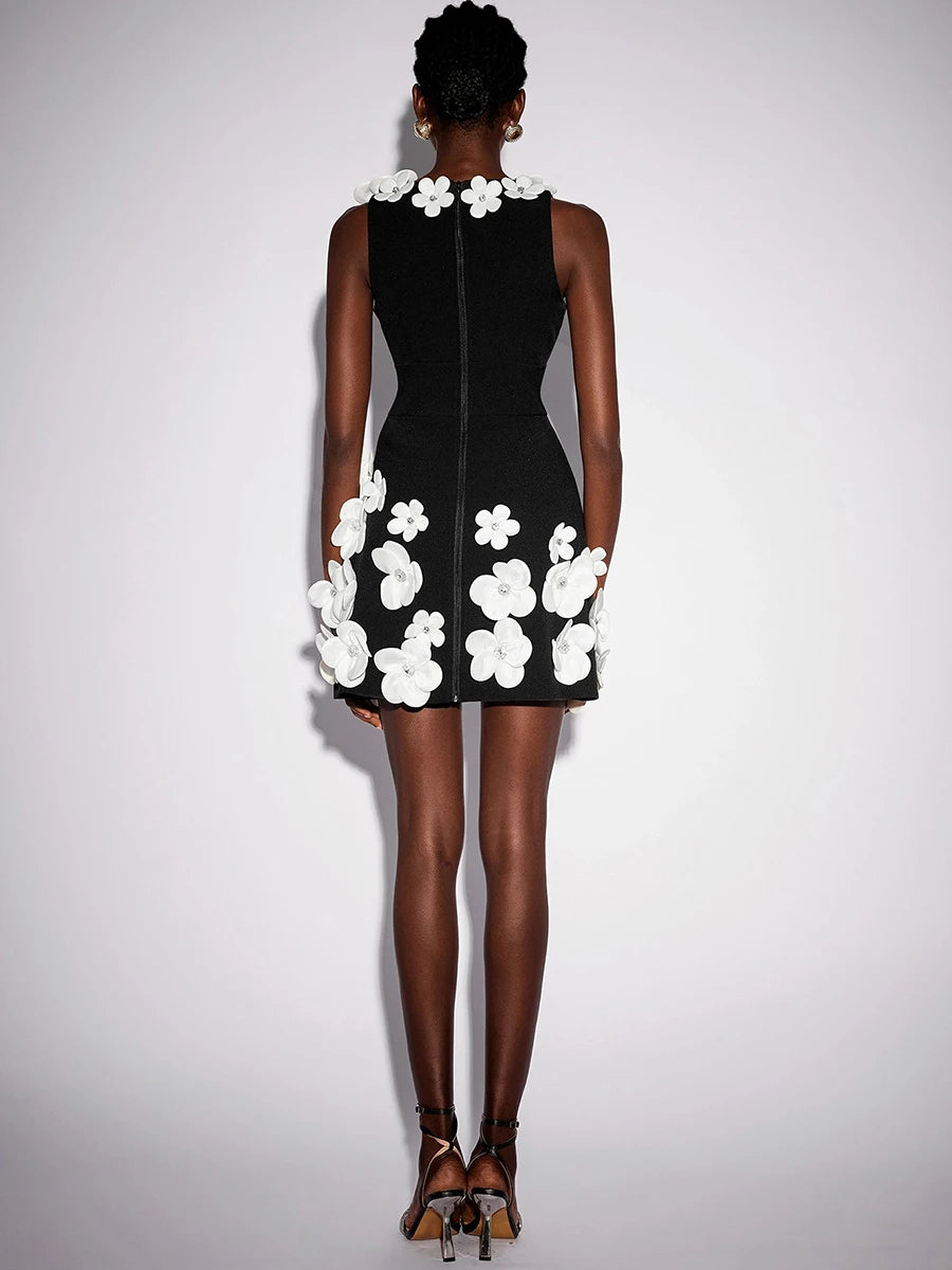 A close-up of the 3D flowers and bead detail on the dress.