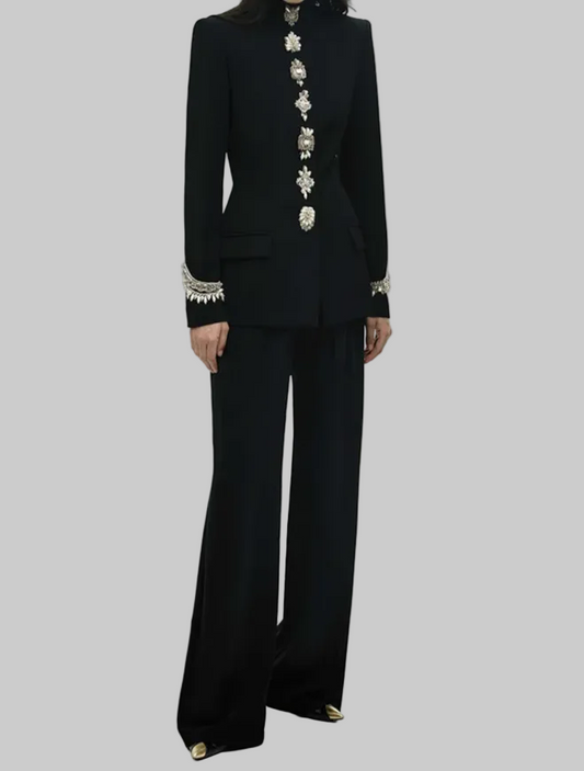 Black embellished stand collar jacket and wide leg pants suit worn by a model