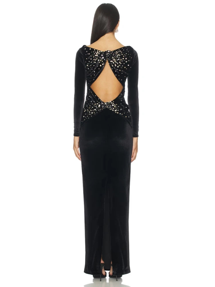 Back view detail of a black velvet gown with crystal accents