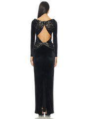 Back view detail of a black velvet gown with crystal accents