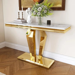 “Gold console table with faux marble top in entryway setting”

